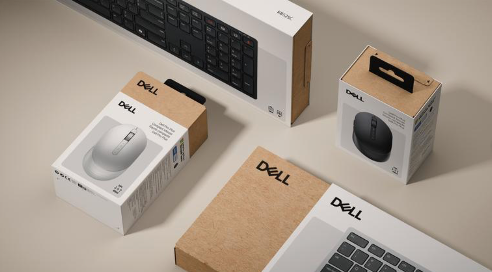 Dell accessories packaging flat lay — mice, keyboards, and sustainable kraft boxes